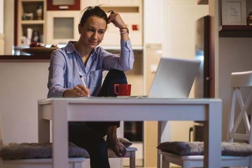 person working from home on laptop