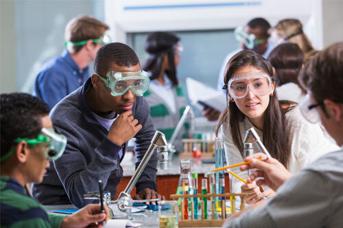 Students doing a chemistry lesson together.